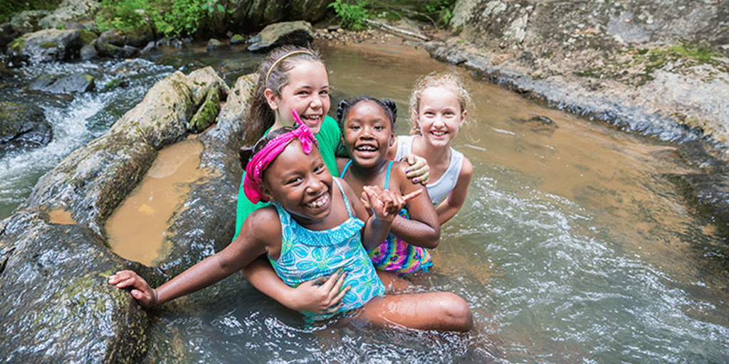 Group of girls playing in a stream