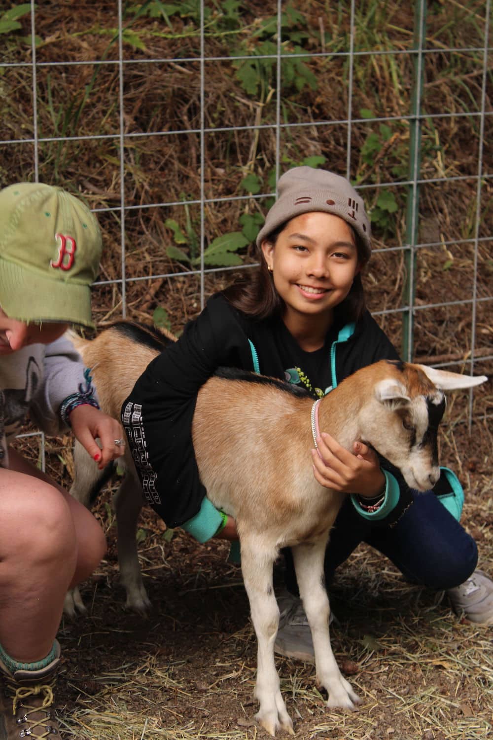 Girls with young goats