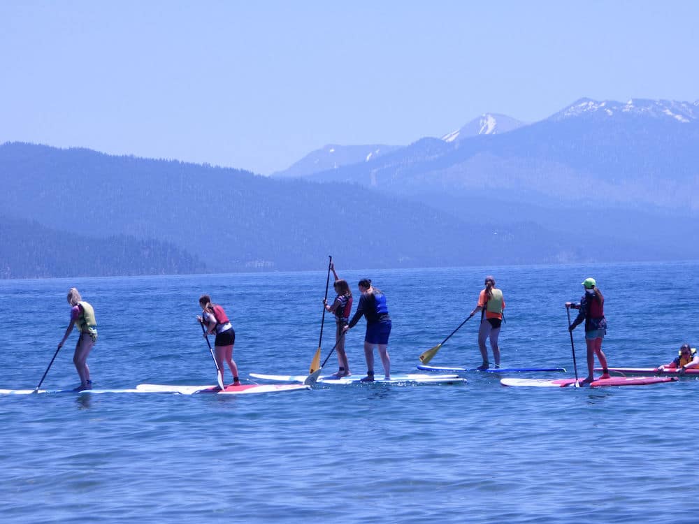 Group of campers on paddle boards
